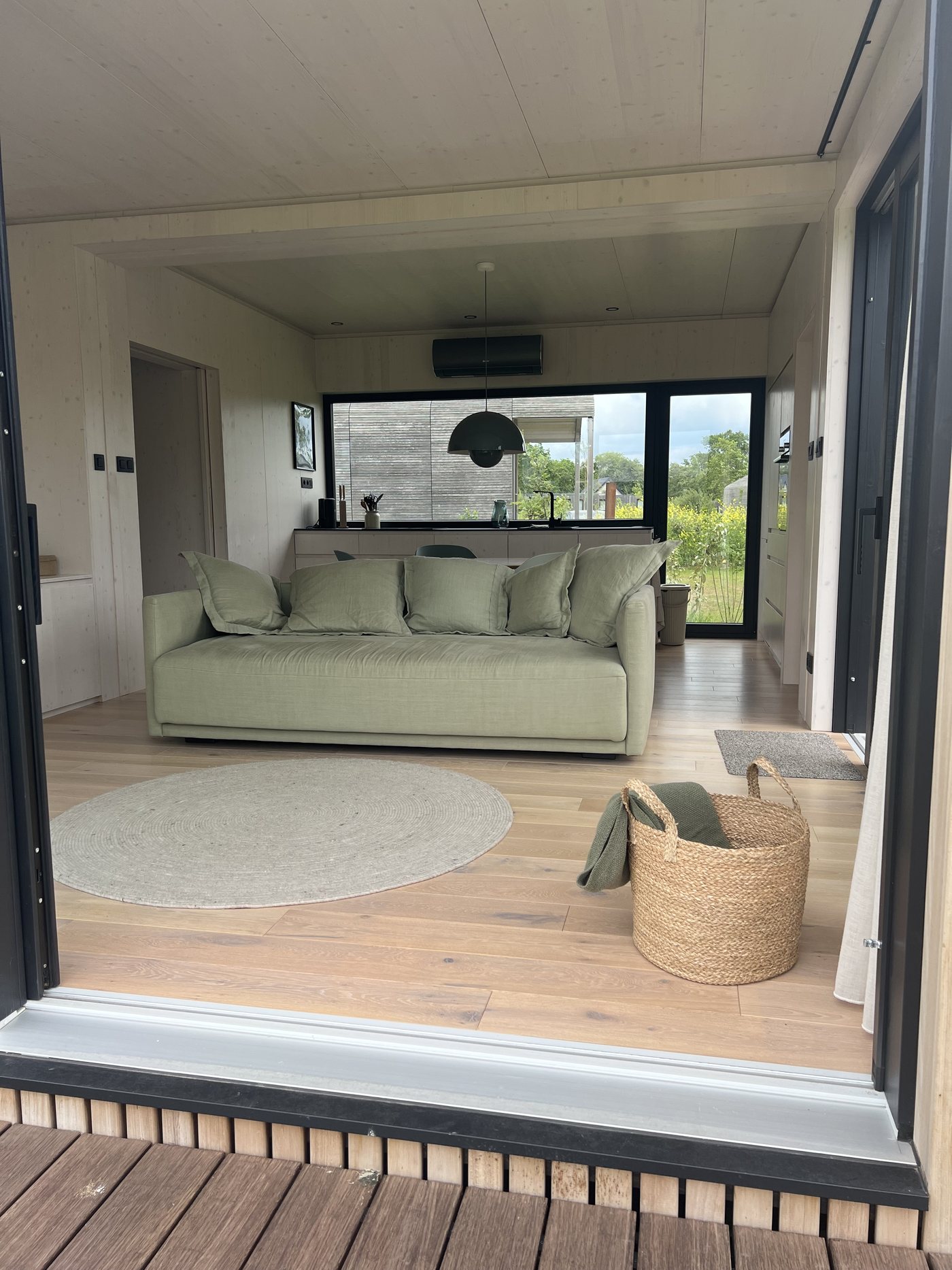View from the terrace through the open sliding door into the living area