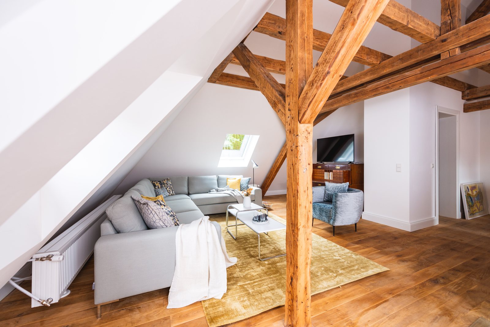 Top-floor living area with exposed timber beams