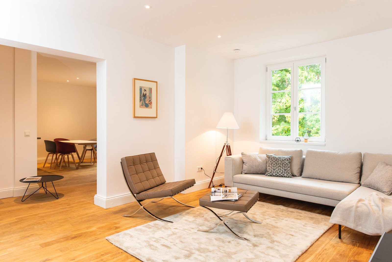 Living area with leather armchair and light sofa
